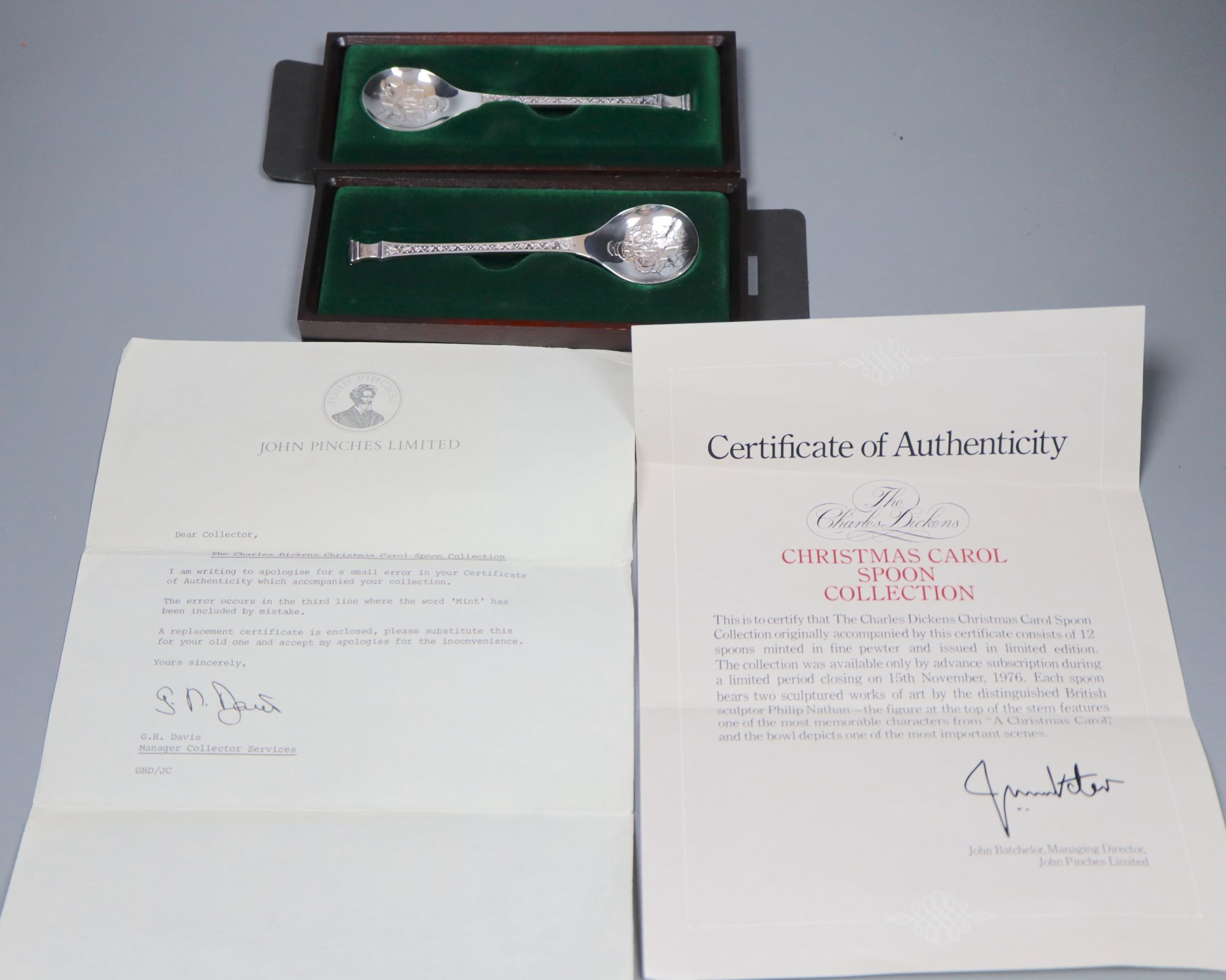 A cased set of six silver teaspoons and two single Christmas spoons